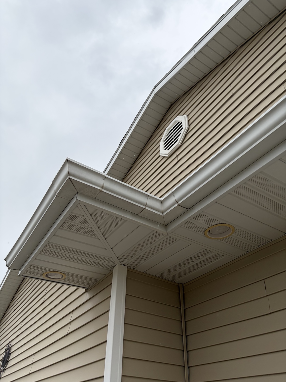 Freshly cleaned gutters at roof corner