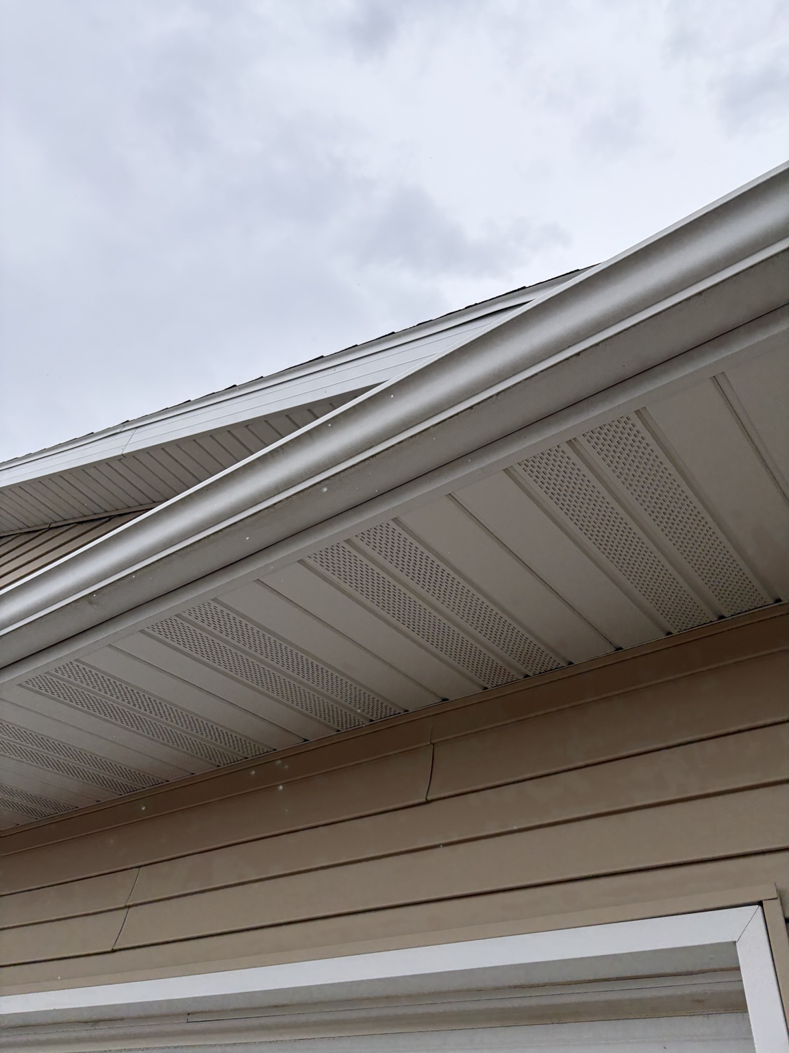 Gutters cleared along peaked roof line